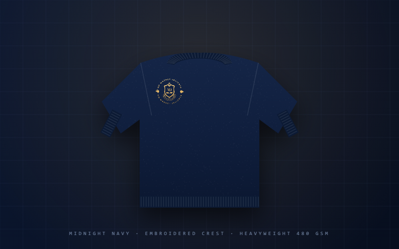 The Heavyweight Crewneck — midnight navy sweatshirt with embroidered gold crest